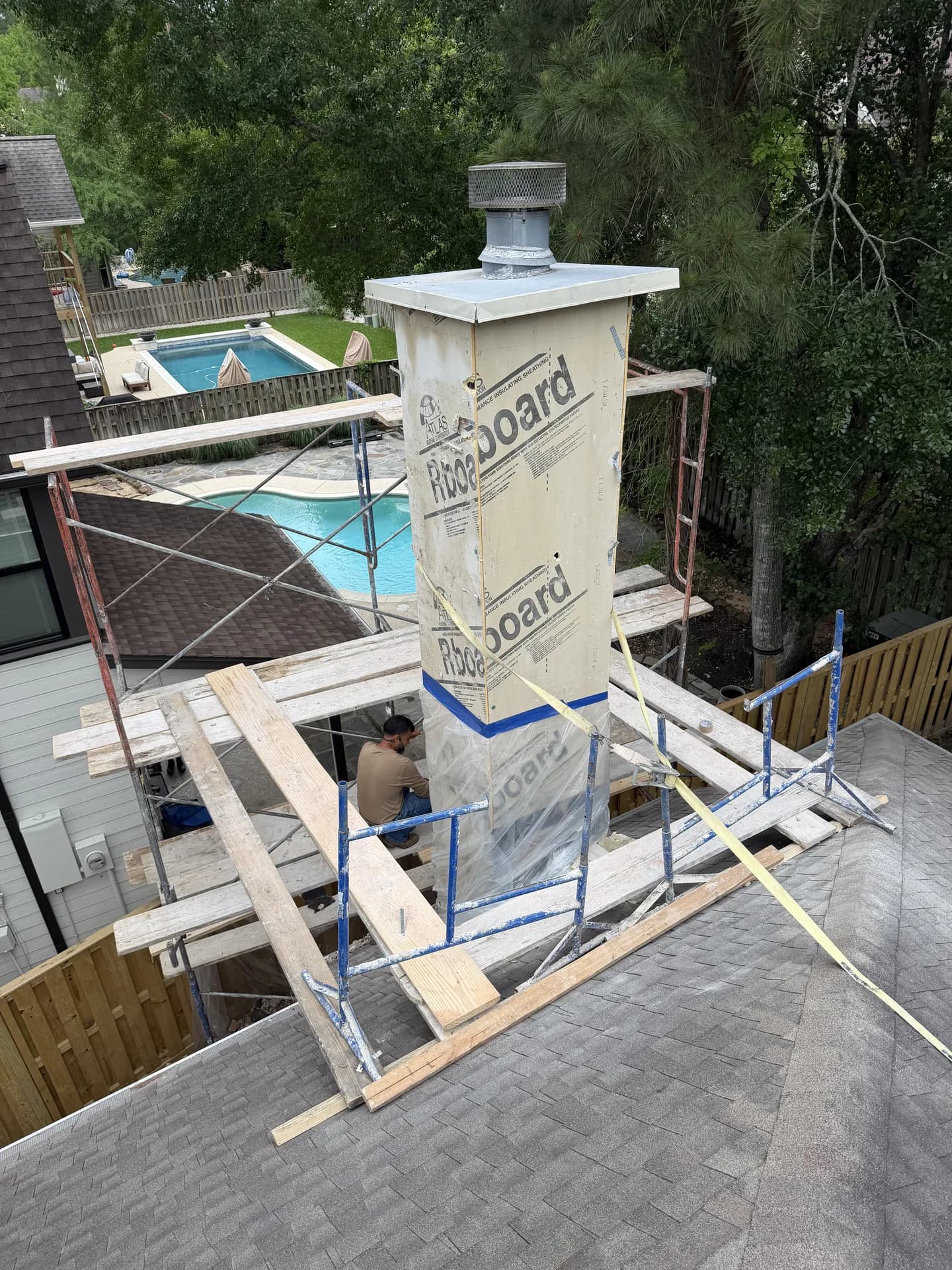 Chimney top rebuilt with new sheathing and a metal cap during a ROYH Build Co chimney crown repair project