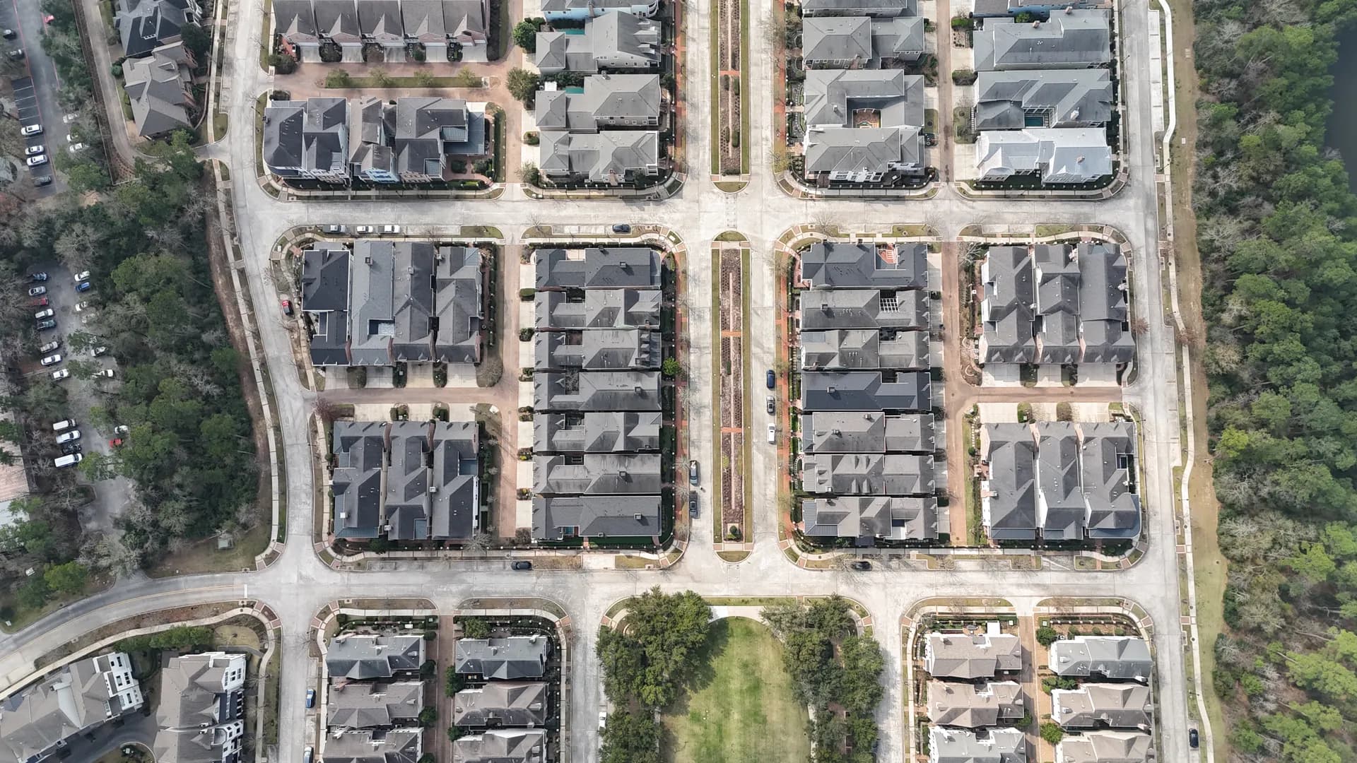Aerial view of a grid of townhome rooftops