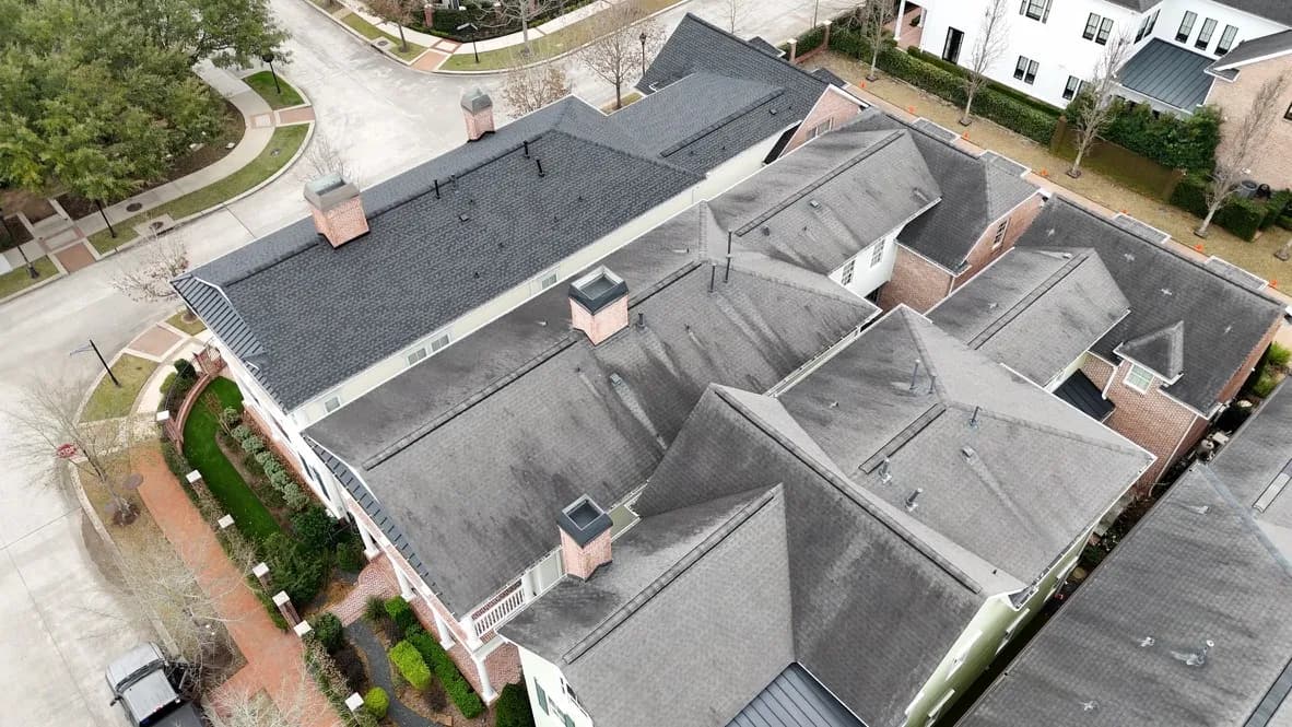 Aerial view of an upscale estate home near The Woodlands, TX, representative of the high-end residential properties suited to DaVinci composite slate and shake roofing